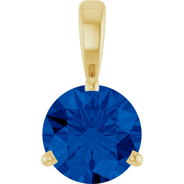 Edelstensanheng i 14 kt gult gull med labfremstilt blå safir, rund sten 6,5 mm fra Smykke24